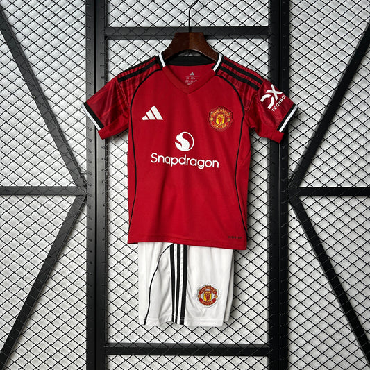 MAGLIA + PANTALONCINO MANCHESTER UNITED HOME BIMBO 25/26