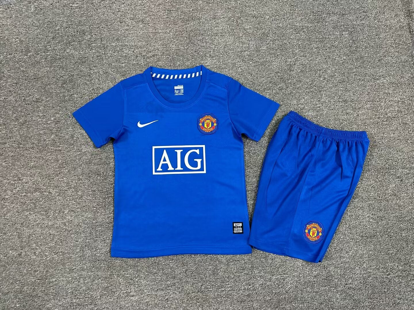 MAGLIA + PANTALONCINO BIMBO MANCHESTER UNITED 08/09